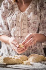 Housewife making dough for dumplings or pasta