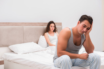 Family conflict with wife and husband in bed