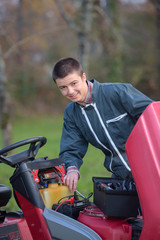 gardener posing on the mower