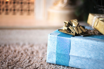 Christmas gift boxes on the floor, close up