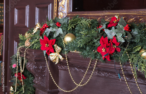 &quot;A fireplace is decorated for Christmas with garland, lights and&quot; Stock photo and royalty-free