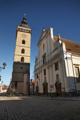 Fototapeta na wymiar Black Tower and St. Nicholas Cathedral in Ceske Budejovice. Czech Republic