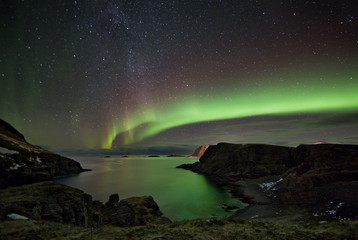 Fototapeta na wymiar Arctic winter nights with northern lights and stars