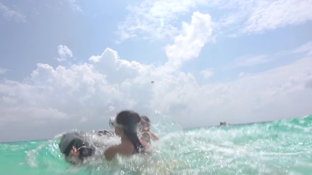 Women Tourists Surfing With Small Jet In Tropical Sea