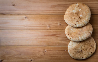 Pita, Arabic bread, wooden background, free text space