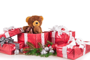 Christmas gifts on a white background with donated bear