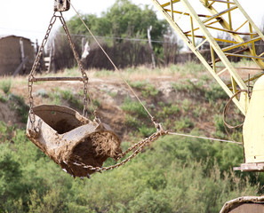 excavator digging a big bucket