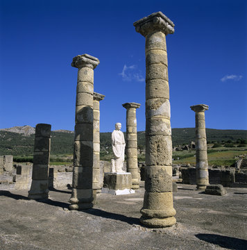 Roman ruins with statue of Emperor Trajan, Baelo Claudia, near Tarifa, Andalucia, Spain