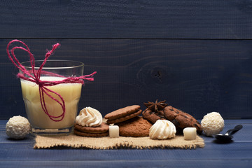 cup with milk near cookies
