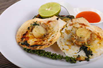 Baked scallops with spinach