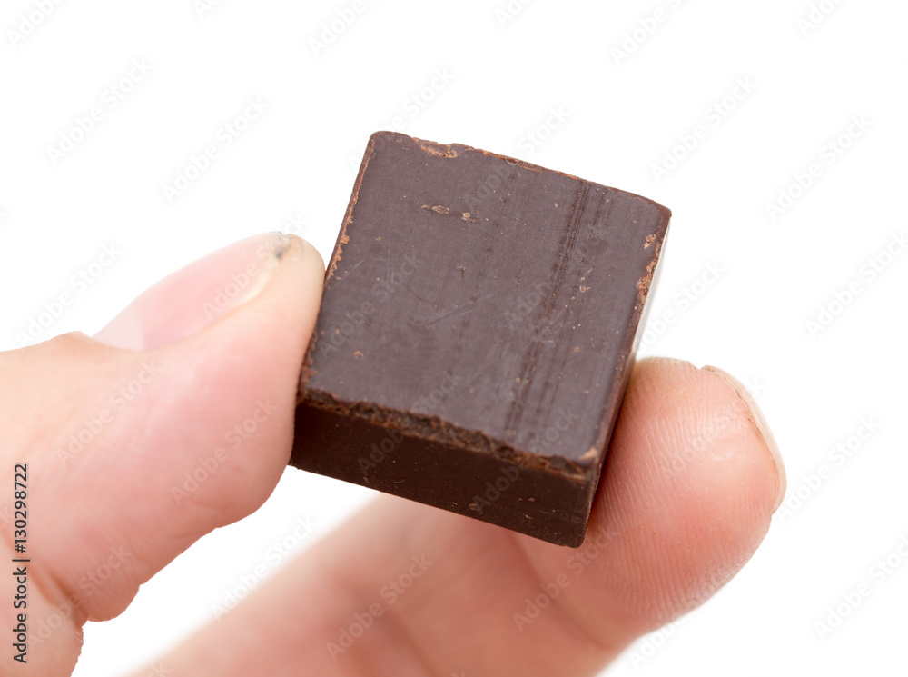 Sticker chocolate in his hand on a white background