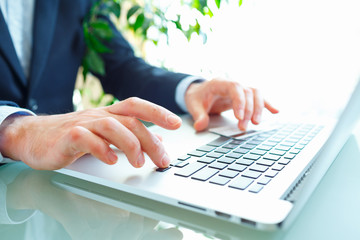 Hands using computer and credit card