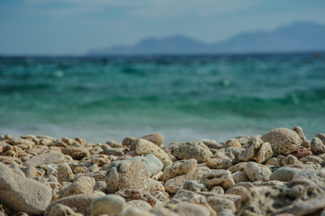 Fototapeta na wymiar turquoise sea and stone on the beach in red sea location tropical