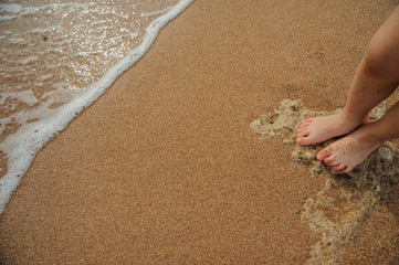 legs of child on the sand beach red sea nice tropical view