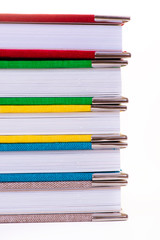Multicolored book textile cover. Photobooks on a white background.