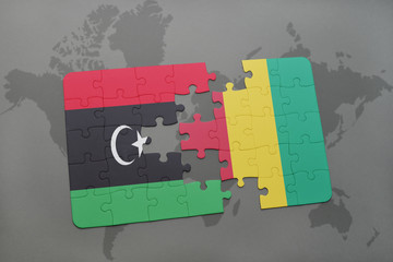 puzzle with the national flag of libya and guinea on a world map