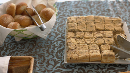 Appetizing fresh bread rolls, pastries and cakes