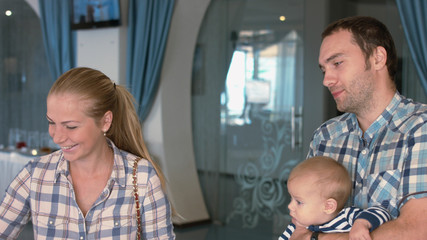 Friendly family at breakfast in the hotel