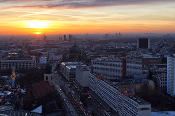 Naklejka na ściany i meble Berlin - Dec. 2016: Beautiful panoramic aerial view over Berlin (Berlin Cathedral - Berliner Dom, City Palace - Stadtschloss, Potsdamer Platz, Bundestag - Reichstag) with romantic colorful sunset.