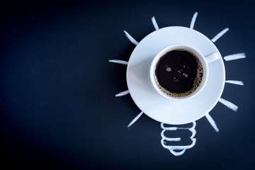 concept coffee awakens brain on dark background top view