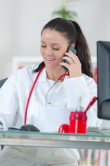 portrait of beautiful specialist woman making call