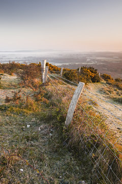 A misty dawn on the countryside surrounding Corfe Castle village, Dorset