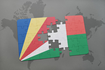 puzzle with the national flag of seychelles and madagascar on a world map