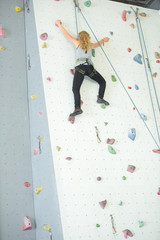 Woman on climbing wall