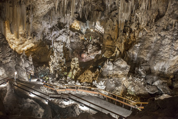 Fototapeta na wymiar Unidentified visitor at Magnificent Nerja Caves, Spain