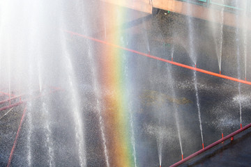 Rainbow in the fountain as a backdrop