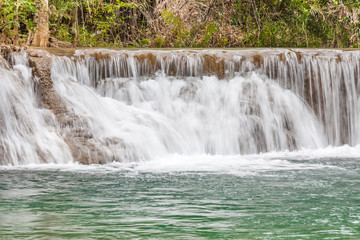 Fototapeta na wymiar Nature background of beautiful waterfall cascades in National Pa