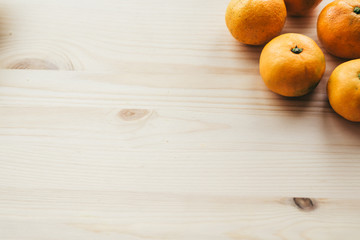 tangerines on a wooden table. place for your text, copy space