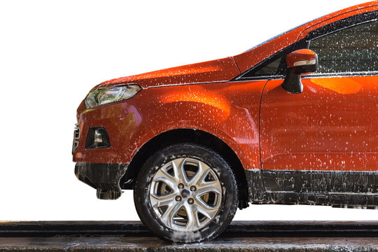 Orange Car With White Soap On The Body In Car Care Shop