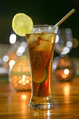 Alcohol cocktail drink on the table, dinner time, candle light