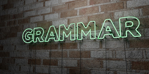 GRAMMAR - Glowing Neon Sign on stonework wall - 3D rendered royalty free stock illustration.  Can be used for online banner ads and direct mailers..