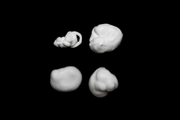 Shave foam or cream isolated on black background