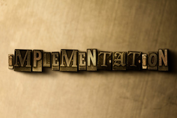 Naklejka premium IMPLEMENTATION - close-up of grungy vintage typeset word on metal backdrop. Royalty free stock illustration. Can be used for online banner ads and direct mail.