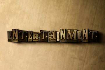 ENTERTAINMENT - close-up of grungy vintage typeset word on metal backdrop. Royalty free stock illustration.  Can be used for online banner ads and direct mail.