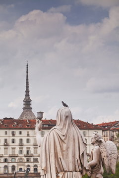 Statues in front of Gran Madre di Dio look over to Mole Antonelliana, Turin, Piedmont