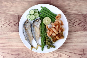 Ready side dish with fired mackarel ,pork rind  and vegetable.