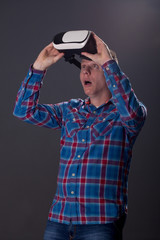 cyberspace and people concept - happy young man with virtual rea