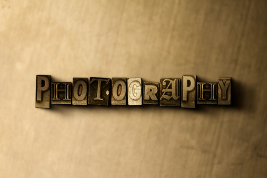 PHOTOGRAPHY - close-up of grungy vintage typeset word on metal backdrop. Royalty free stock illustration.  Can be used for online banner ads and direct mail.