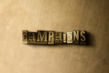 CAMPAIGNS - close-up of grungy vintage typeset word on metal backdrop. Royalty free stock illustration.  Can be used for online banner ads and direct mail.