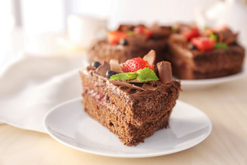 Delicious chocolate cake with strawberry on plate