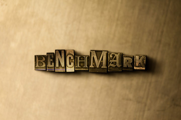 BENCHMARK - close-up of grungy vintage typeset word on metal backdrop. Royalty free stock illustration.  Can be used for online banner ads and direct mail.