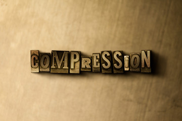 Fototapeta na wymiar COMPRESSION - close-up of grungy vintage typeset word on metal backdrop. Royalty free stock illustration. Can be used for online banner ads and direct mail.