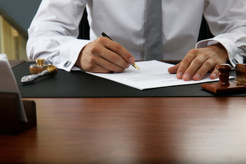 Notary public signing document in office