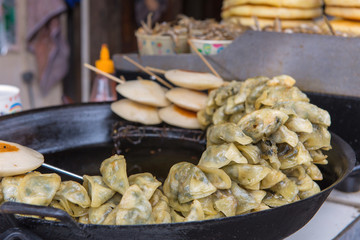 Fried Chinese traditional spring rolls in market