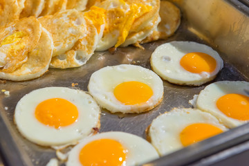 fried eggs heap on plate for breakfast