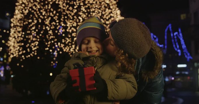  Cinemagraph Of Little Boy With Present In Front Of Christmas Tree